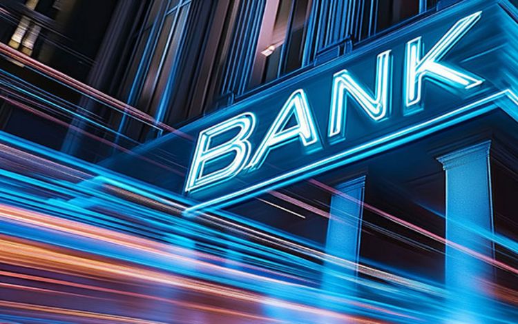 Bank mit Neonschrift als Symbol für die gesamten Banken-Branche